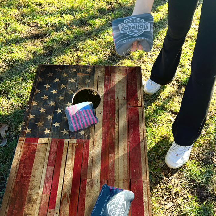 World Series of Cornhole Recreational Cornhole Set - Rustic Left-Facing American Flag Boards with Red and Blue Bags
